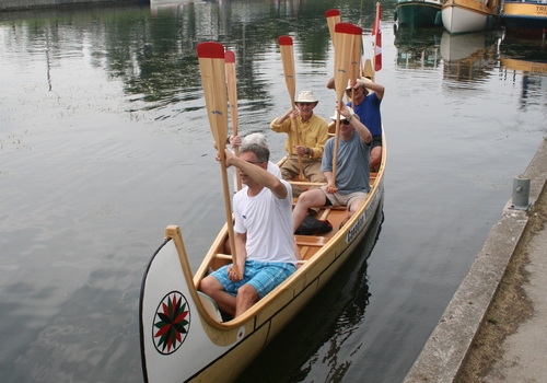A traditional voyager salute in a successfully completed North canoe.