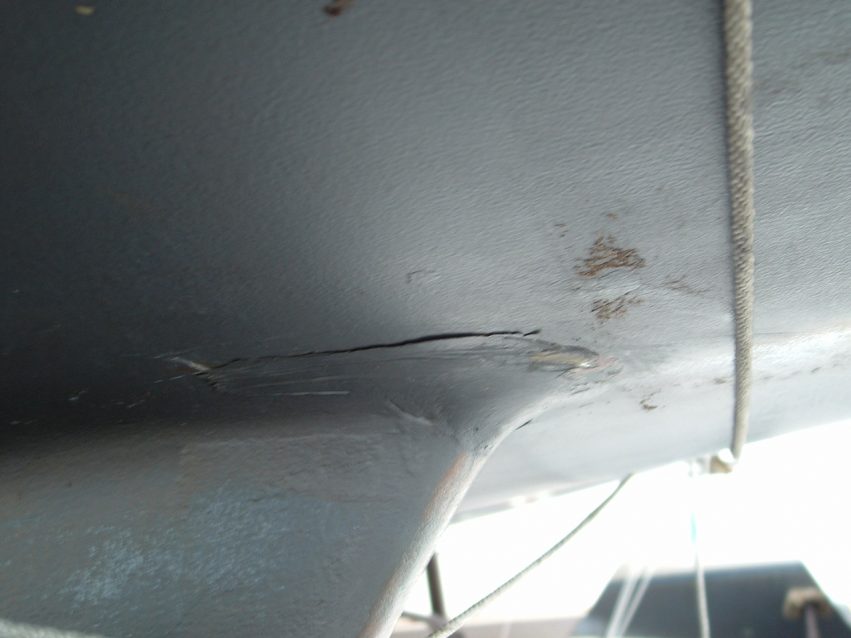 Multiple small cracks in fairing compound on each side of keel varied from 6" to 12" long.