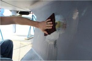 Once the epoxy had cured, the keel surface was cleaned with a Scotch-Brite® pad and water to remove amine blush (greasy film) that forms on cured G/flex Epoxy. The surface was dried with plain white paper towels to avoid leaving any contaminates behind.