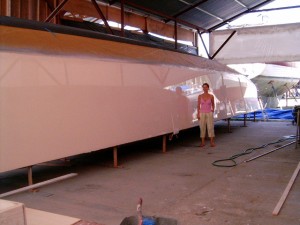 The 55' catamaran's hull, faired and sprayed