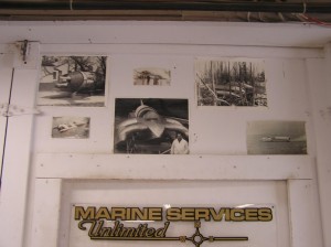 Photos of Les Staudacher's STARS &amp; STRIPES over the door leading into the front shop area of Marine Services Unlimited.