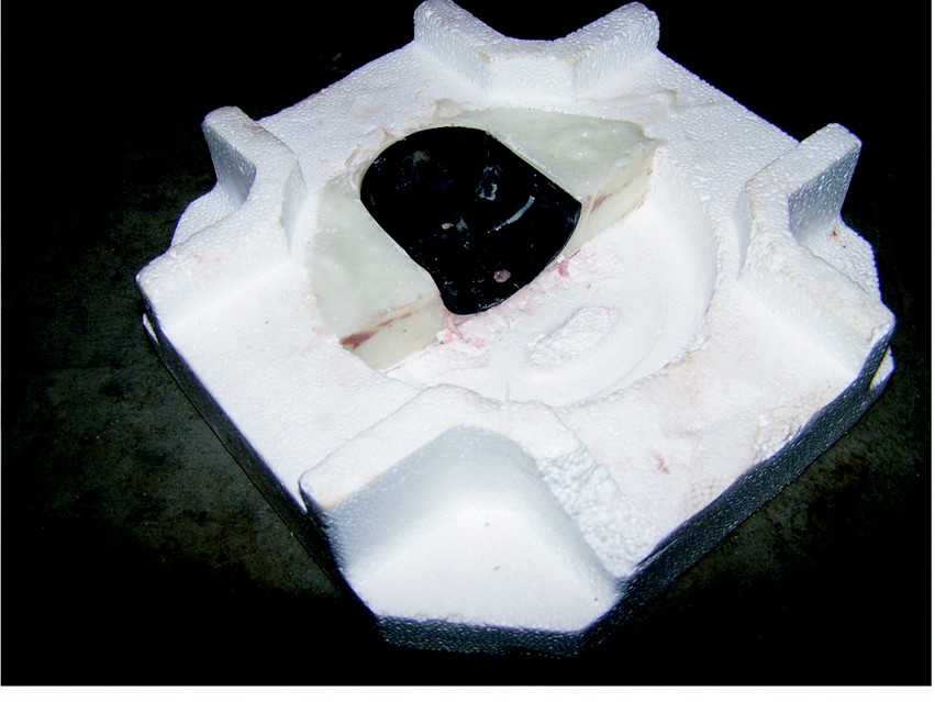 The existing cap was used to make a female mold in the thickened epoxy.