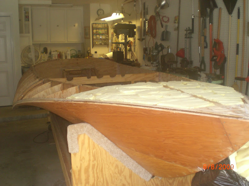 Bow cavity filled with foam and rough cut in preparation for sanding it fair. The total amount of foam in the boat gives it a buoyancy of 3,600 lbs.