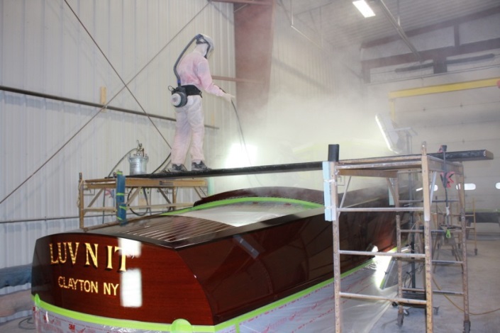 Van Dam Custom Boats is comfortable with multiple finish approaches and finish products. In this case, as on many of its new boats, Trevor Brazell sprays an automotive clear coat over the top of the WEST SYSTEM 105/207 on the exterior.