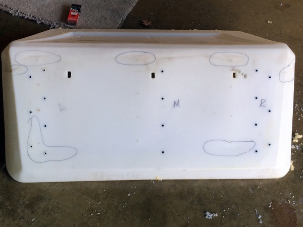 The cleaned bottom of the seat shell. The circles highlight the areas where cracks need to be repaired.