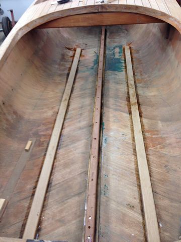 The inside bottom of the Cadillac Runabout reinforced with white oak stringers to help flatten the whoop-di-doos before beginning to fair the hull.