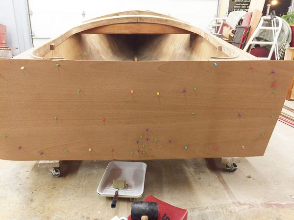 Transom veneer temporarily held in place using push pins