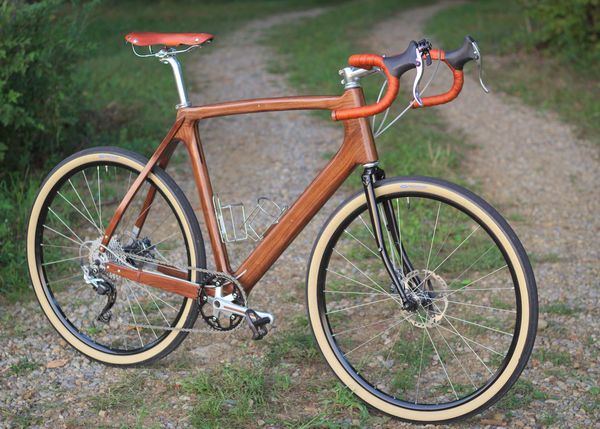 The completed wooden bicycle with its beautiful grain pattern