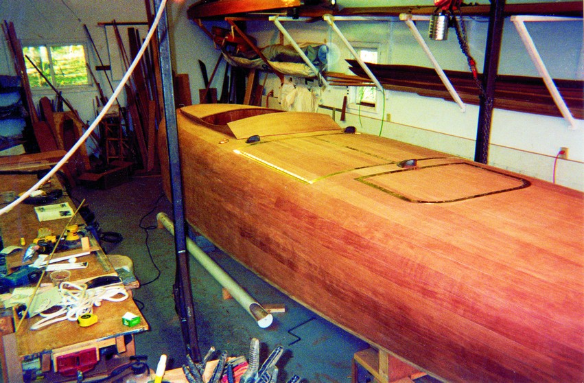 Final fairing and finishing was a lot of work. After many hours of long boarding and block sanding, four coats of tung oil, ten coats of epifanes no-sand, and three coats of Z-spar Flagship, it was pretty much done.