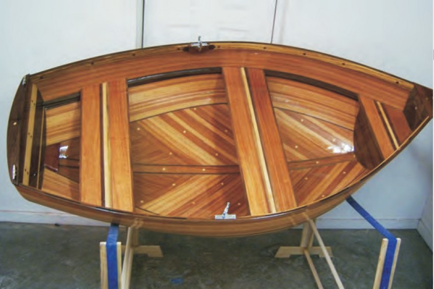 The finished strip plank dinghy on display.