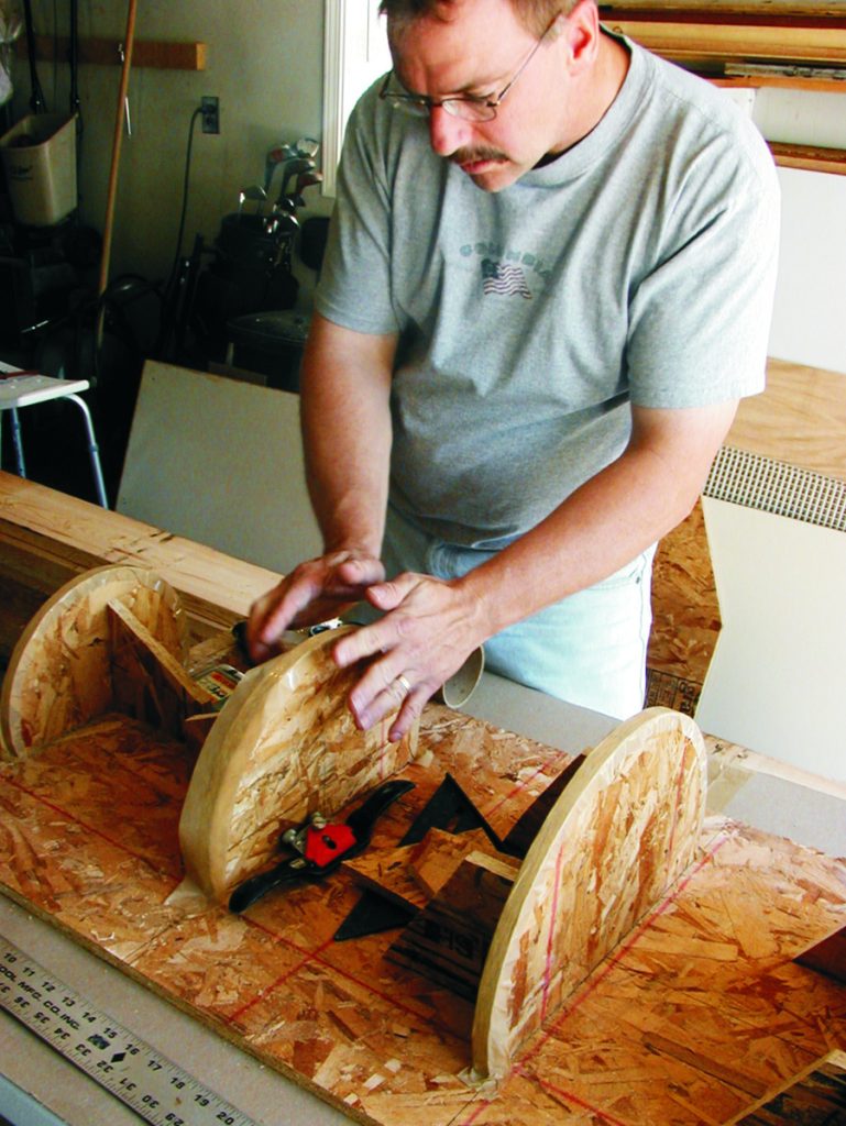 Bob covers the lighthouse mold frames with tape