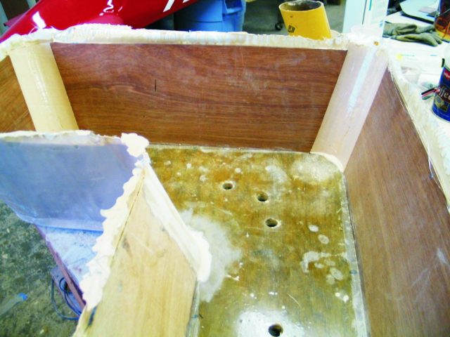 3—After the mold/tubes were removed, a layer of 6 oz cloth was applied to the exterior. Holes were drilled in the bottom for drainage.