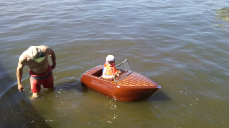 Daniel's grandson happily floating in his custom, pedal powered runabout.