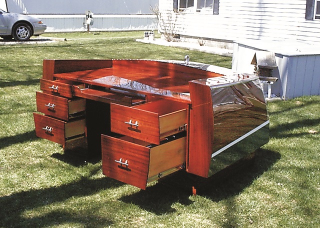 Mahogany desk with wooden runabout styling