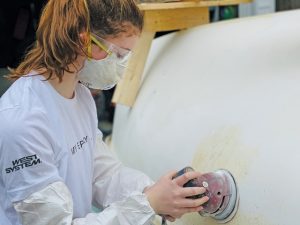 A Club 420 dinghy getting some TLC