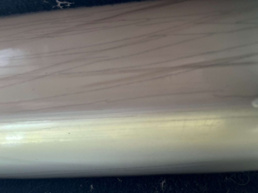 Close up of the gelcoat crakcs on the bottom of the hull. - Epoxyworks #60, Spring 2025.